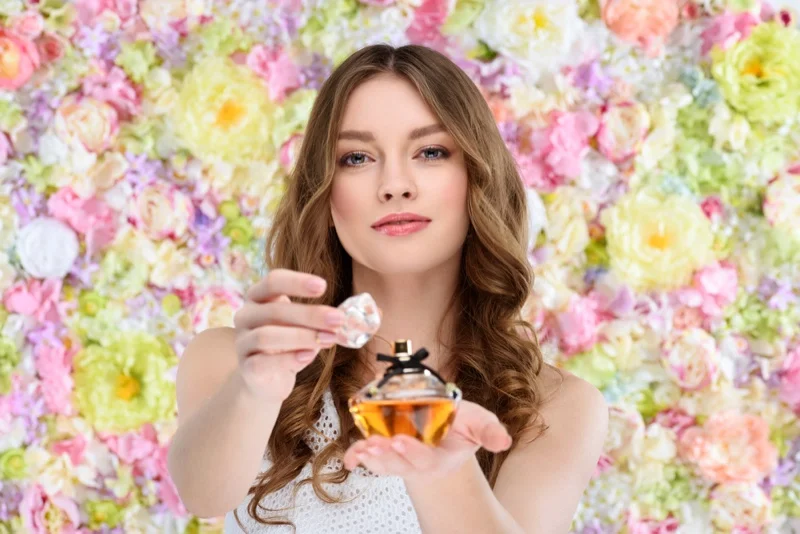 Flower Backdrop Model Holding Perfume Fragrance Bottle